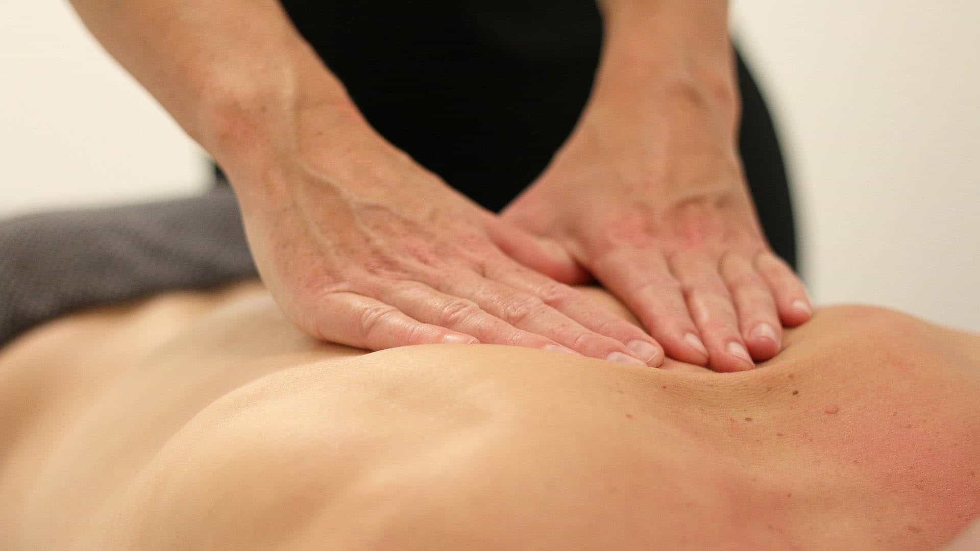 Deep Tissue Massage with hands pressing on back