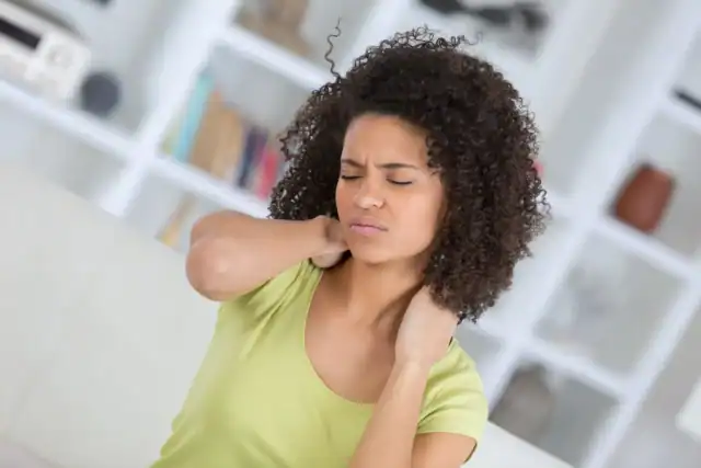 Woman holding her neck with discomfort while stretching.